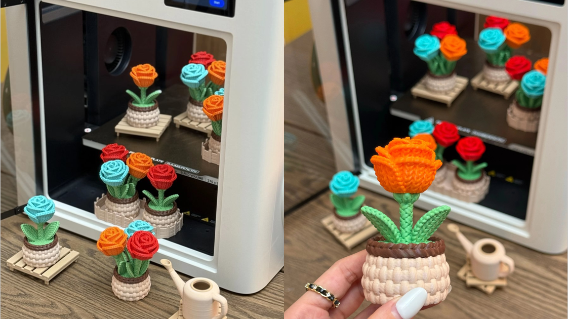 displaying a batch of finished multi-color knitted rose pots both inside the build chamber and on the surrounding table.